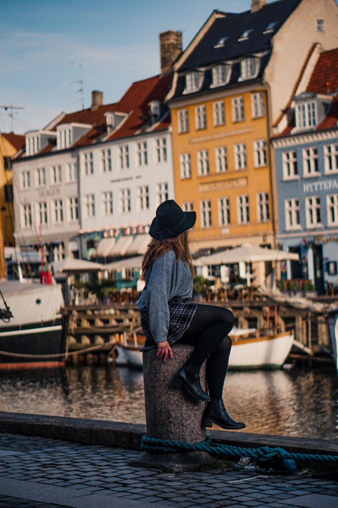 Me sitting on a pole in Nyhavn - La Vie En Marine