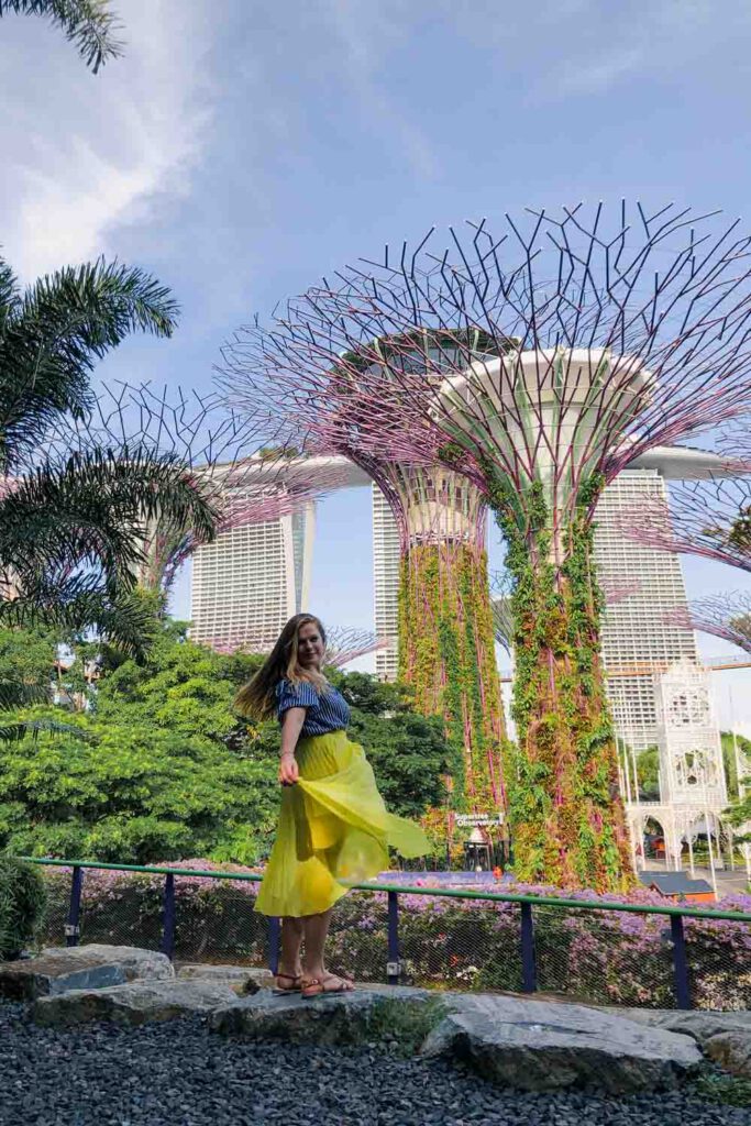 girl twirling in front of the Super Trees, Singapore