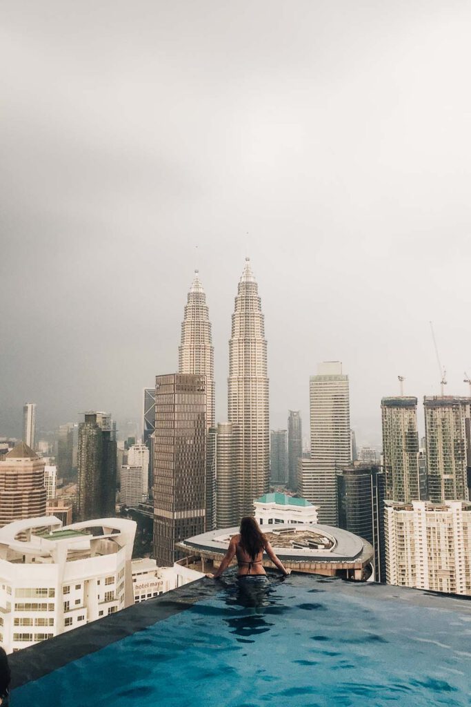 Girl on the edge of an infinity pool