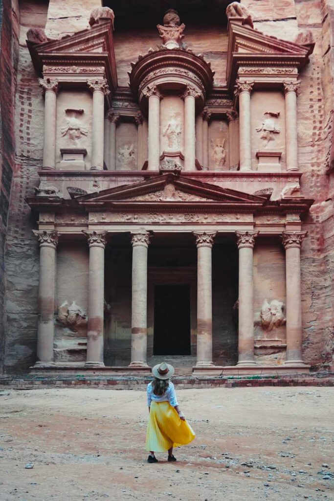 girl standing in front of the treasury petra