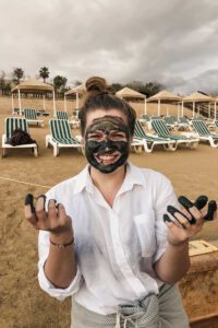 girl with mud from the dead sea on her face
