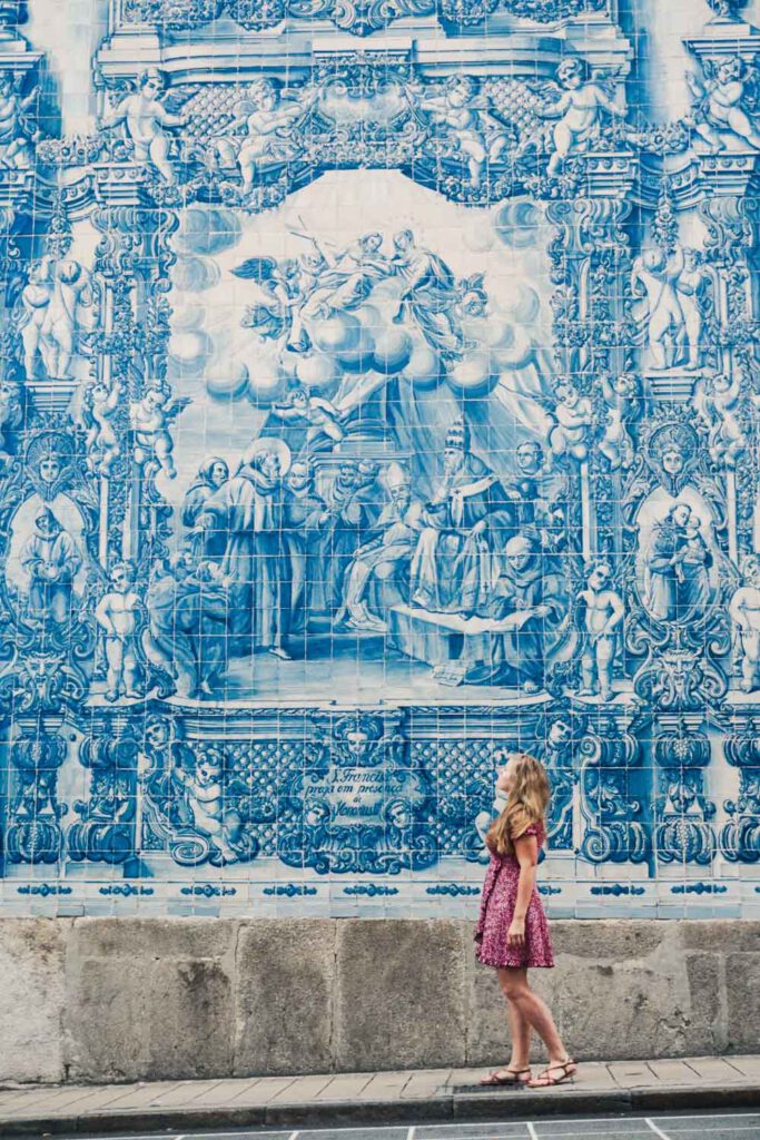 Girl in front of the blue church in porto