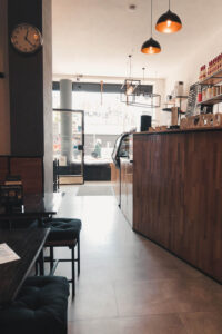 Cafes in Duesseldorf - Kyto. The interior of the Kyto is created with light wood and industrial furniture. It has a very modern and cool atmosphere!