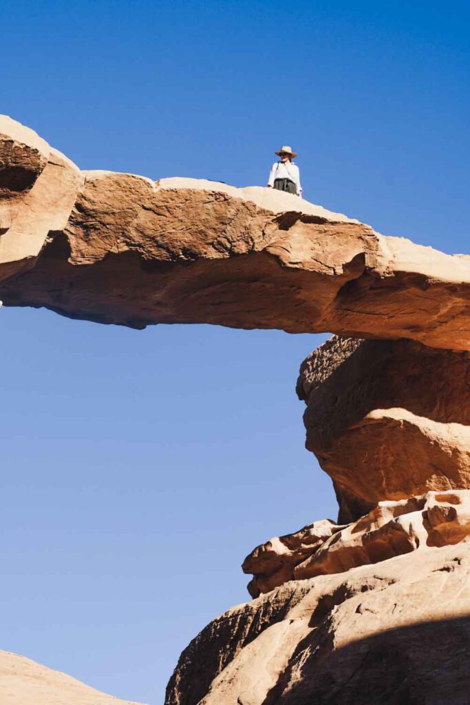 climbing rock formations in Wadi Rum